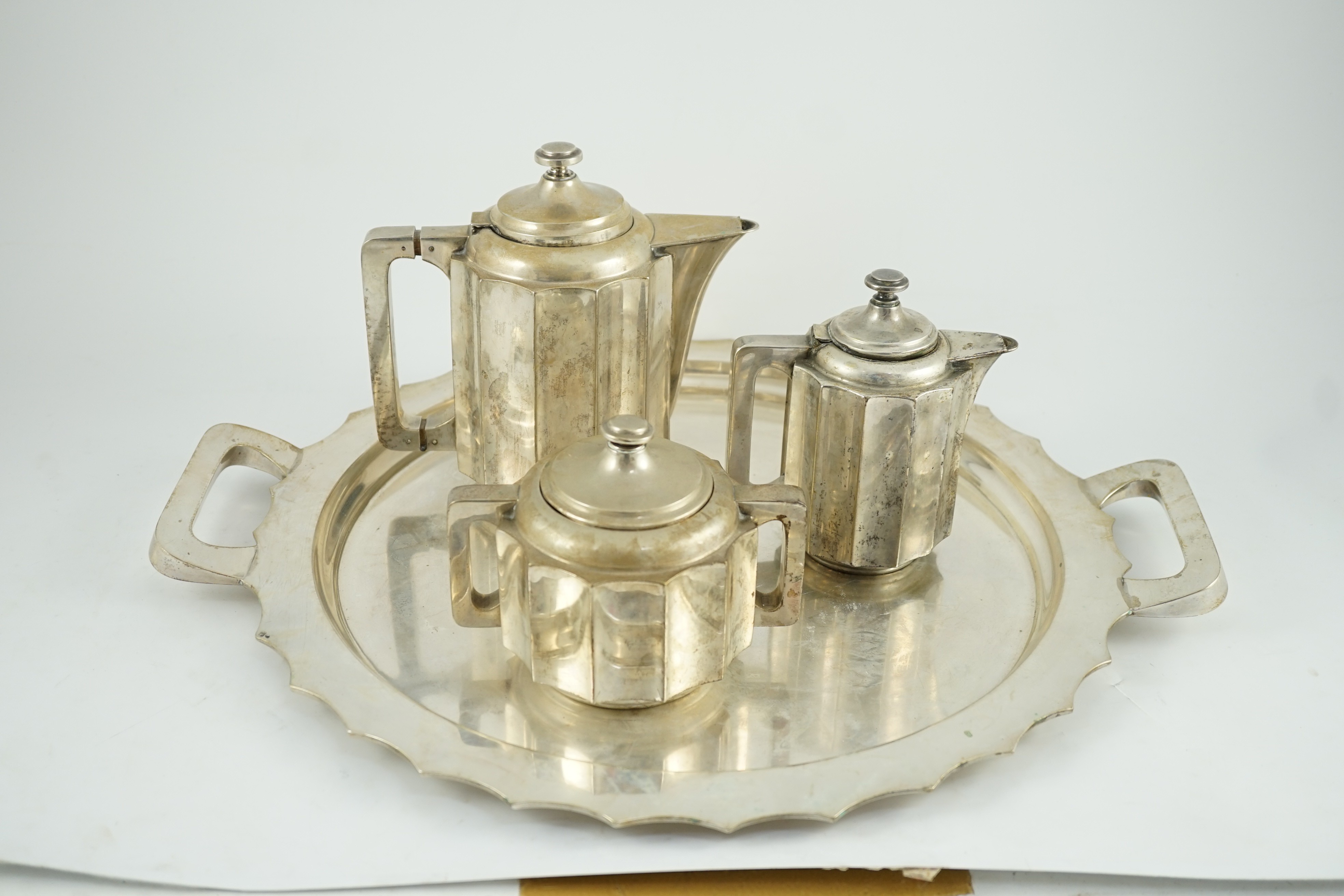 A 20th century Portuguese Art Deco three piece 833 standard silver tea set with two handled tea tray